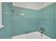 Vintage-style bathroom with beautiful turquoise tile surround on the tub and walls at 2261 Star Mist Sw Dr, Atlanta, GA 30311