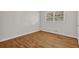 Bedroom featuring hardwood floors and a window for natural light at 2261 Star Mist Sw Dr, Atlanta, GA 30311