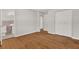 Bedroom with hardwood floors leading to an ensuite bathroom, enhancing privacy and comfort at 2261 Star Mist Sw Dr, Atlanta, GA 30311
