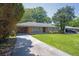 Charming brick ranch home with a well-manicured lawn and a long driveway at 2261 Star Mist Sw Dr, Atlanta, GA 30311