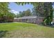 Inviting brick ranch-style home boasting a green lawn and adorned with mature trees at 2261 Star Mist Sw Dr, Atlanta, GA 30311