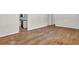 Open living space with hardwood floors transitioning into a kitchen with modern appliances at 2261 Star Mist Sw Dr, Atlanta, GA 30311