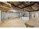 Unfinished basement with concrete floor, exposed ceiling, and potential for customization at 2725 Glendale Ne Dr, Conyers, GA 30013