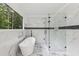 This bathroom has a soaking tub, glass shower and large window with nature views at 2725 Glendale Ne Dr, Conyers, GA 30013