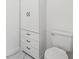 This bathroom has a toilet and white built-in storage unit at 2725 Glendale Ne Dr, Conyers, GA 30013