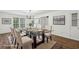 Virtually staged dining room featuring a glass top table and seating for six, with neutral decor at 2725 Glendale Ne Dr, Conyers, GA 30013