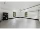 Spacious garage with painted floors, white walls, and black trim at 2725 Glendale Ne Dr, Conyers, GA 30013