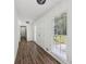 Bright hallway features wood floors, white walls and leads to other rooms at 2725 Glendale Ne Dr, Conyers, GA 30013