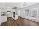 Spacious kitchen featuring an island, granite countertops, and hardwood floors with dining space at 2725 Glendale Ne Dr, Conyers, GA 30013