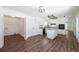Open kitchen featuring an island, white cabinets, granite counters, and stainless appliances at 2725 Glendale Ne Dr, Conyers, GA 30013