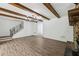 Open concept living room with hardwood floors and staircase with ornate iron railings at 2725 Glendale Ne Dr, Conyers, GA 30013
