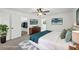This main bedroom features a ceiling fan, walk-in closet and is virtually staged at 2725 Glendale Ne Dr, Conyers, GA 30013