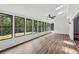 Sunroom with many windows, hardwood floors, a ceiling fan and views of the backyard at 2725 Glendale Ne Dr, Conyers, GA 30013