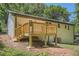 Exterior view of a backyard deck with wooden railings and stairs at 290 Bromack Se Dr, Atlanta, GA 30315