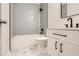 Modern bathroom with stylish tile work, tub, and sleek black fixtures at 290 Bromack Se Dr, Atlanta, GA 30315