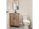 Updated half bathroom features a modern vanity, sleek mirror, and stylish hexagon tile flooring at 290 Bromack Se Dr, Atlanta, GA 30315