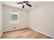 This bedroom has a ceiling fan and wood-look floors at 290 Bromack Se Dr, Atlanta, GA 30315