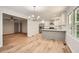 Kitchen and dining area with new stainless steel appliances, quartz countertops, and updated lighting at 290 Bromack Se Dr, Atlanta, GA 30315