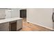 Kitchen island featuring a wine fridge and quartz countertop open to dining area at 290 Bromack Se Dr, Atlanta, GA 30315