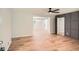 Spacious living area featuring beautiful wood floors and a view to an adjacent room at 290 Bromack Se Dr, Atlanta, GA 30315