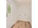 A mud room featuring an exterior door and hardwood flooring at 290 Bromack Se Dr, Atlanta, GA 30315