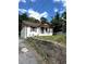 Charming home with painted brick, a cozy porch, and a stone retaining wall at 303 Anderson Nw Ave, Atlanta, GA 30314