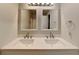 Bathroom features a double sink vanity with square mirrors and modern faucets at 1232 Pinedale Nw Cir, Conyers, GA 30012