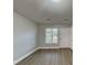 Bright living room boasts hardwood floors, neutral paint, and natural light at 1232 Pinedale Nw Cir, Conyers, GA 30012