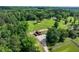 Aerial view of the house and land, showing pasture, outbuildings, trees, and a driveway at 1780 Penn Camp Road, Douglasville, GA 30134