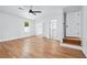 Bright bedroom featuring hardwood floors, a ceiling fan, and access to an ensuite bathroom at 1780 Penn Camp Road, Douglasville, GA 30134
