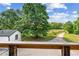View of the front yard, driveway, and large trees creating a beautiful canopy at 1780 Penn Camp Road, Douglasville, GA 30134