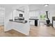 Bright kitchen with white cabinets, granite countertops, and a breakfast bar overlooking the living area at 1780 Penn Camp Road, Douglasville, GA 30134