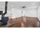 Spacious living room features hardwood floors, a ceiling fan, and an open layout, perfect for entertaining at 1780 Penn Camp Road, Douglasville, GA 30134