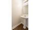 Half bathroom with a pedestal sink and modern fixtures at 2727 Parkway Trl, Lithonia, GA 30058