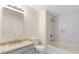 Renovated bathroom with granite countertop, updated tile, and shower-tub combination at 2727 Parkway Trl, Lithonia, GA 30058