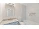 Renovated bathroom with granite countertop, updated tile, and shower-tub combination at 2727 Parkway Trl, Lithonia, GA 30058