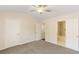 Bright bedroom with neutral walls, ceiling fan and carpet flooring, with an ensuite bathroom at 2727 Parkway Trl, Lithonia, GA 30058
