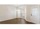 Bright dining area with large windows, stylish chandelier, and hardwood flooring at 2727 Parkway Trl, Lithonia, GA 30058