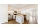 Modern kitchen with stainless steel appliances, a granite island, and ample lighting at 2727 Parkway Trl, Lithonia, GA 30058