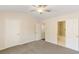 Main bedroom with neutral carpet, vaulted ceiling, and attached bathroom at 2727 Parkway Trl, Lithonia, GA 30058
