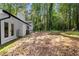 Rear of home showing the yard, patio, and white painted brick at 2984 E Paulding Dr, Dallas, GA 30157