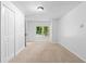 Empty bedroom featuring large closet and window with green view at 2984 E Paulding Dr, Dallas, GA 30157