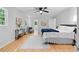 Bright bedroom featuring hardwood floors, white rug and ceiling fan at 2984 E Paulding Dr, Dallas, GA 30157