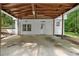 Carport view shows brick accents and outdoor living space at 2984 E Paulding Dr, Dallas, GA 30157