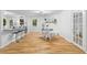 Bright dining area with hardwood floors and a breakfast bar leading into the kitchen at 2984 E Paulding Dr, Dallas, GA 30157