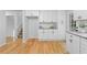 Bright kitchen with white cabinets, granite countertops, and stainless steel appliances at 2984 E Paulding Dr, Dallas, GA 30157