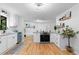 Open kitchen featuring white cabinetry, granite countertops, stainless steel appliances, and a seamless flow to living areas at 2984 E Paulding Dr, Dallas, GA 30157