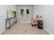 Cozy living room with neutral decor, a comfortable chair, and a view to the outside, ideal for relaxation at 2984 E Paulding Dr, Dallas, GA 30157