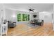 Sun-filled living room with hardwood floors, stylish furniture, and backyard view at 2984 E Paulding Dr, Dallas, GA 30157