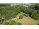 Scenic aerial view of a home surrounded by lush greenery and neighboring houses at 7376 Bates Dr, Cumming, GA 30040